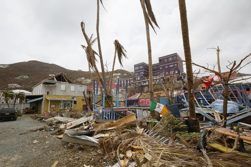 Destroyed houses on a beach in the Caribbean.