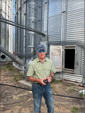 Brad Doorn, Program Manager of NASA’s Water Resources and Agriculture Program Areas stands in front of a grain silo at Frahm Farms in Colby, Kansas. Credits: NASA